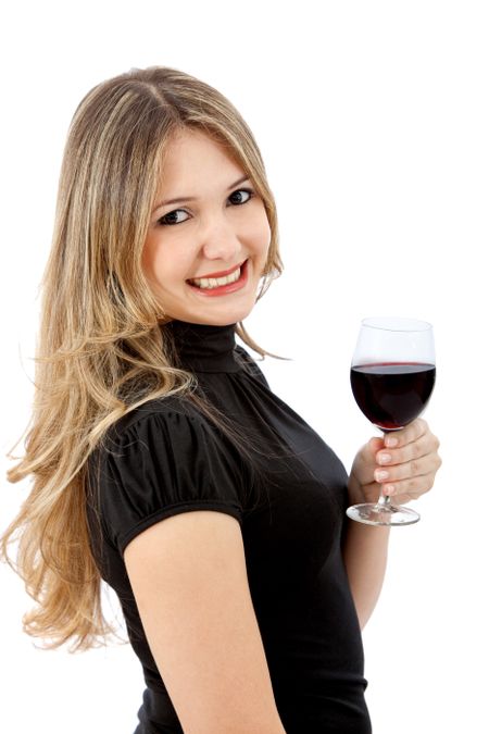 Beautiful drinking woman with a glass of wine isolated over white