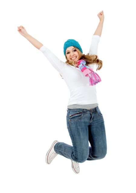 winter woman smiling and jumping full of joy isolated over a white background