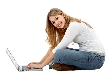 casual woman looking happy on a laptop computer isolated over white