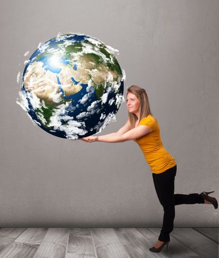 Pretty young girl holding 3d planet earth