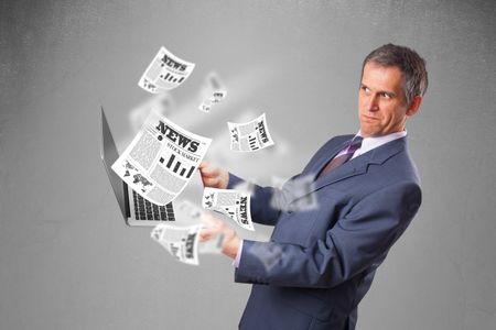 Handsome middle aged businessman holding notebook and reading the explosive newspaper