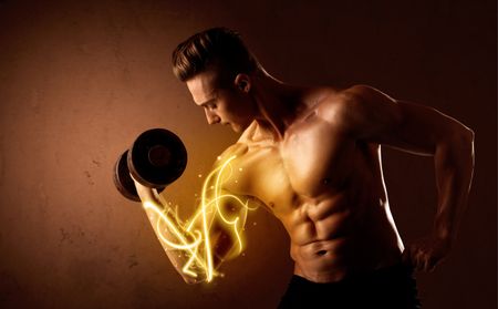 Muscular body builder lifting weight with energy lights on biceps concept