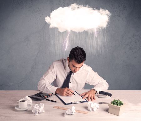 An elegant office worker is having a bad day while working, illustrated by a white cloud above his head with heavy rain and thunder concept