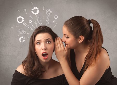 Two girlfriends in elegant black dress sharing secrets with each other concept with drawn rack cog wheels and spiral lines on the wall background.