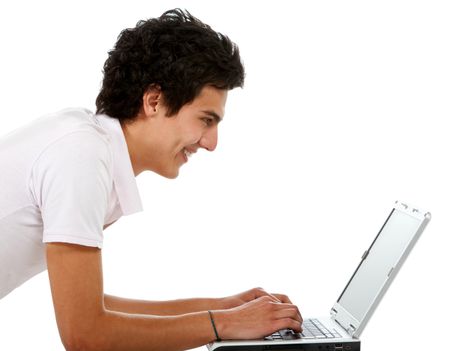Casual guy on a laptop working on the floor over a white background