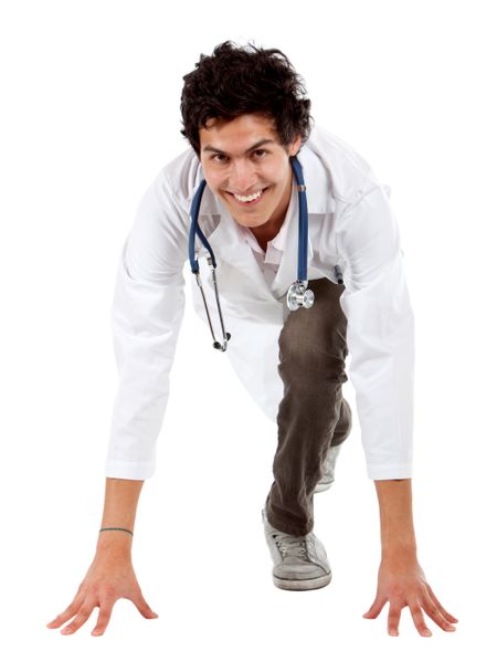 friendly male doctor smiling ready to race isolated over white