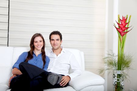 Beautiful couple portrait smiling at home