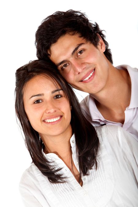 Beautiful couple portrait smiling isolated over white