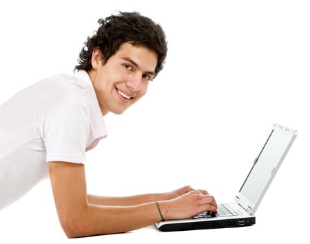 Casual man on a laptop working on the floor over a white background