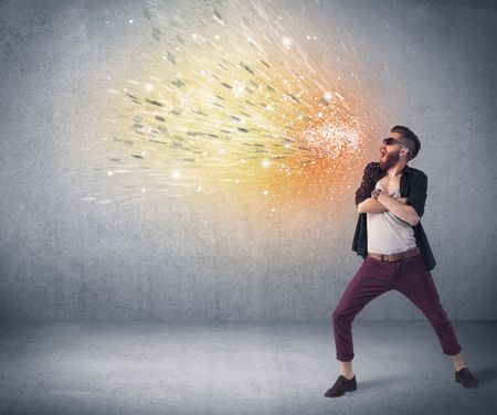 young-hipster-guy-beard-sunglasses-shouting-484931719 A young hipster guy with beard and sunglasses shouting in front of urban wall with vomit like colorful paint splatter on wall concept