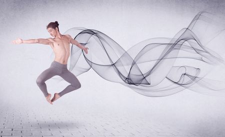 Modern ballet dancer performing with abstract swirl concept on background