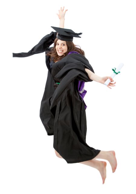 female graduate jumping and smiling full of joy over a white background
