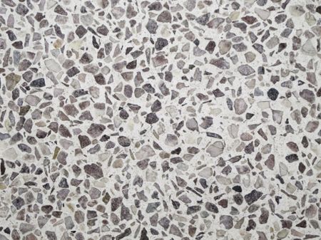 Conglomerate background: detail of indoor flooring with various kinds of stone