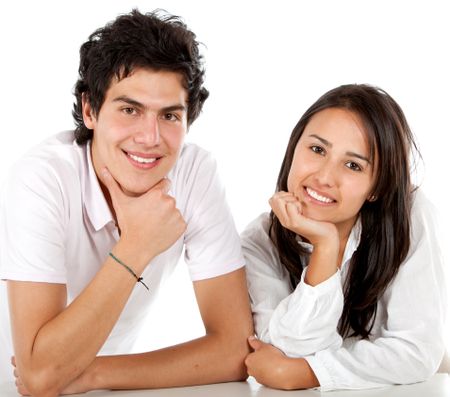 Beautiful couple portrait smiling isolated over white