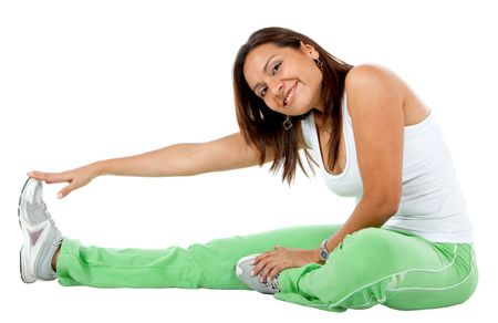 woman doing stretching exercises on the floor isolated over a white background