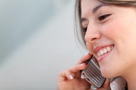 Business woman talking on the phone in her office