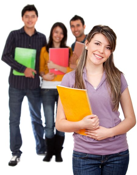 Beautiful female student with holding a notebook with her friends behind her isolated over a white background
