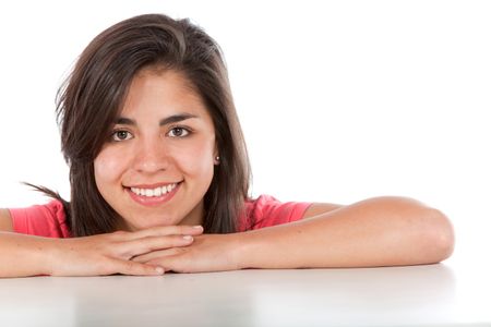 casual woman smiling and leaning on her hands isolated over a white background