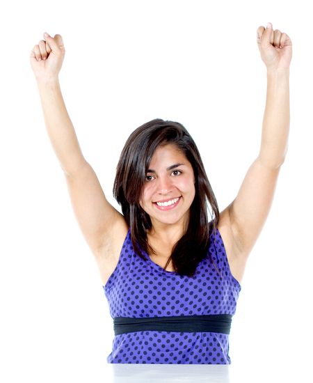 casual woman smiling full of success with her arms up over a white background
