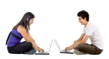 Young people sitting with laptop computers - isolated over white