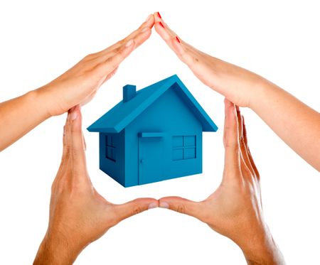 Hands making a house isolated over a white background