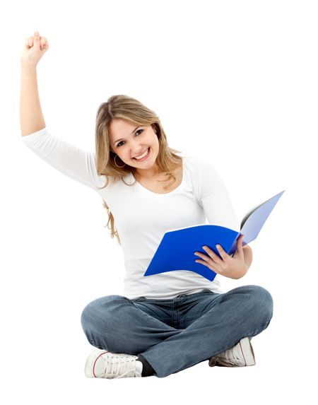 Happy female student sitting with a notebook - isolated on white