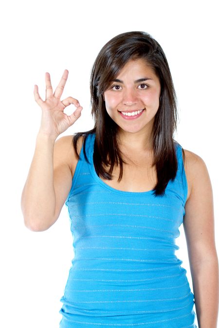 Girl making an ok sign with her hand - isolated over white