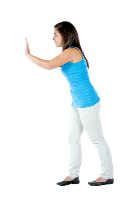 Woman pushing an imaginary object - isolated over a white background