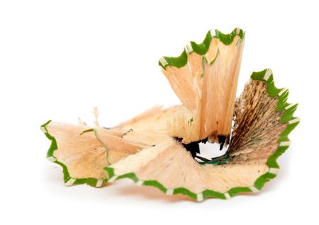 Wood shaving after a pencil has been sharpen - isolated on white