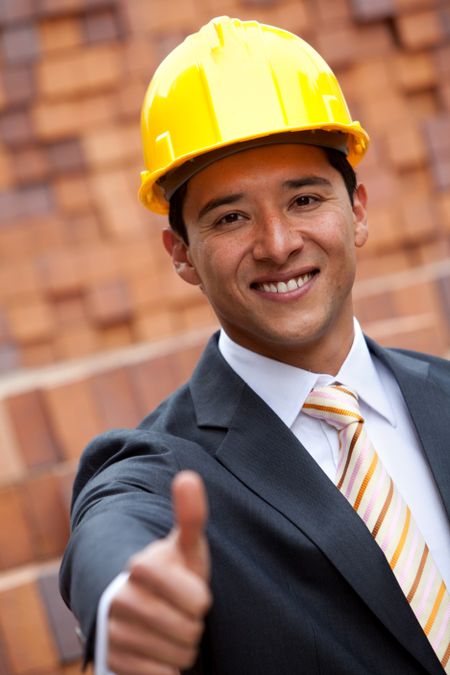 Engineer with thumbs-up at a construction site