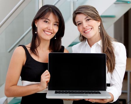 Business women with a computer at the office