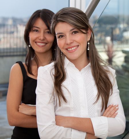 business-women-portrait-smiling-office-49115866 Business women portrait smiling at the office