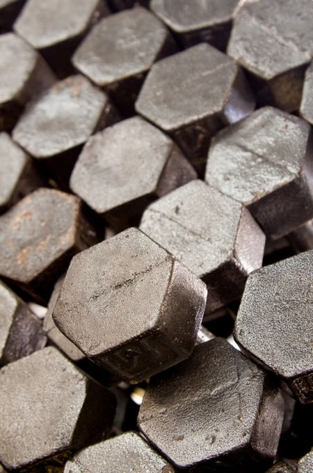 Pile of hexagon pieces creating a metallic surface