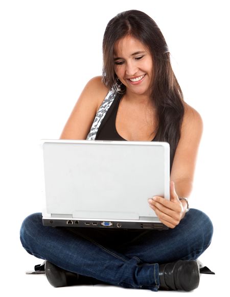 Woman sitting on the floor with a computer - isolated