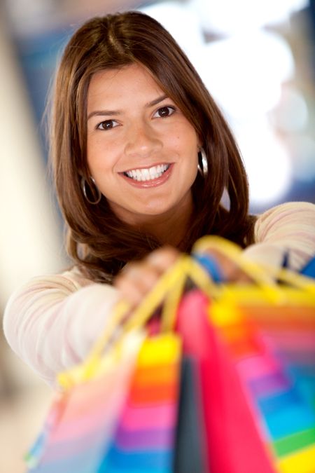 Beautiful woman with shopping bags at the mall