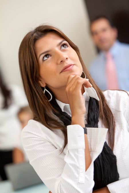 Beautiful pensive business woman at the office