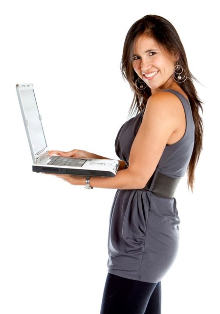 Casual woman holding a laptop and smiling - isolated over white