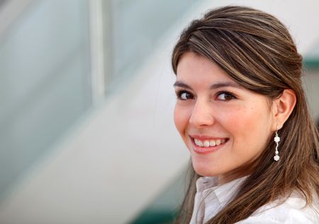 Young business woman portrait at the office smiling
