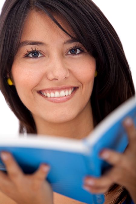 Woman smiling with a notebook isolated over a white background