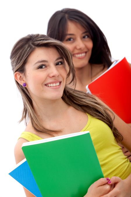 Female students holding notebooks isolated over a white background