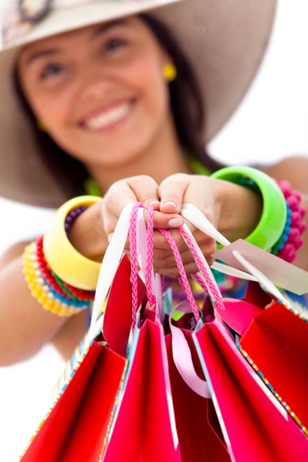 Woman shopping for the summer isolated over a white backgound