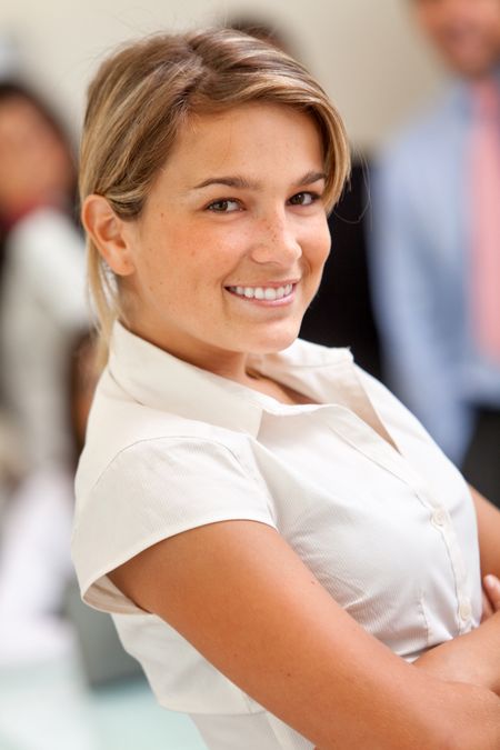 Beautiful business woman at the office smiling