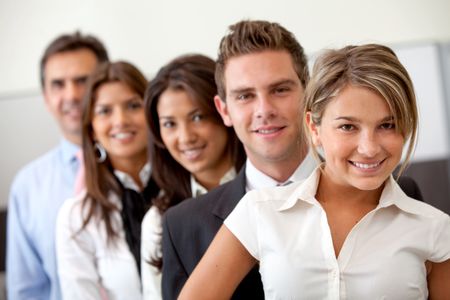 Group of business people at the office smiling