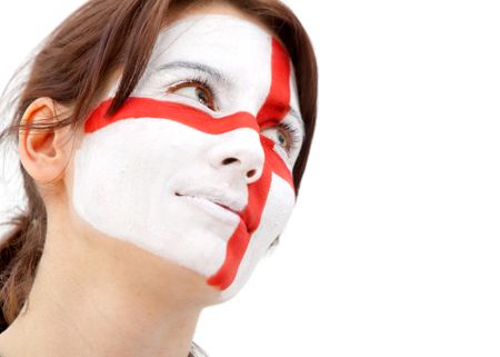 Portrait of a woman with the english flag paited on her face - over a white background