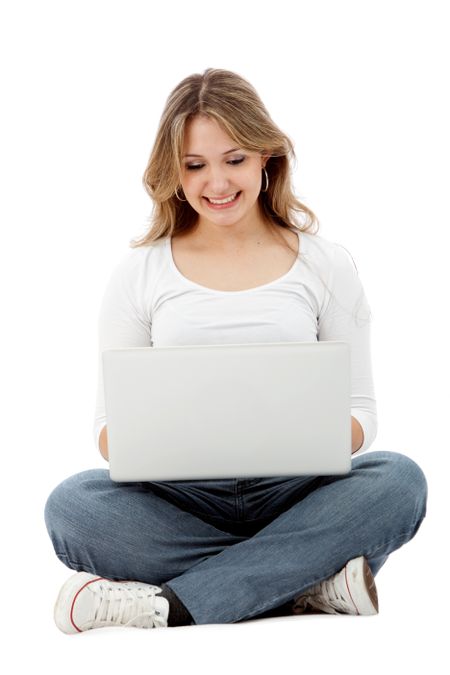 Woman sitting with a laptop isolated over a white background