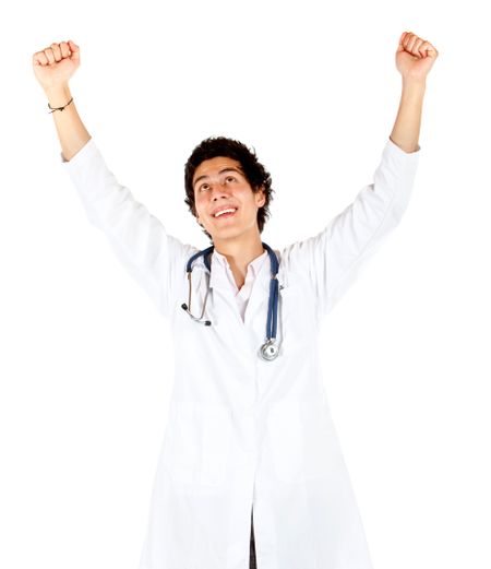 Happy male doctor with arms up isolated over a white background