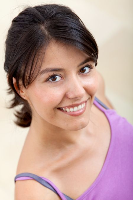 fitness woman smiling and looking happy at the gym