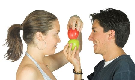 couple putting apples on top of another