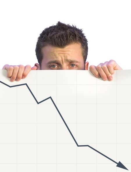 dissapointed business man holding a card with a graph going down