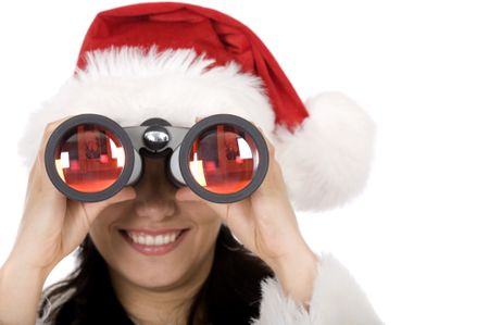 beautiful female santa holding binoculars over a white background